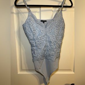 Light blue bodysuit.